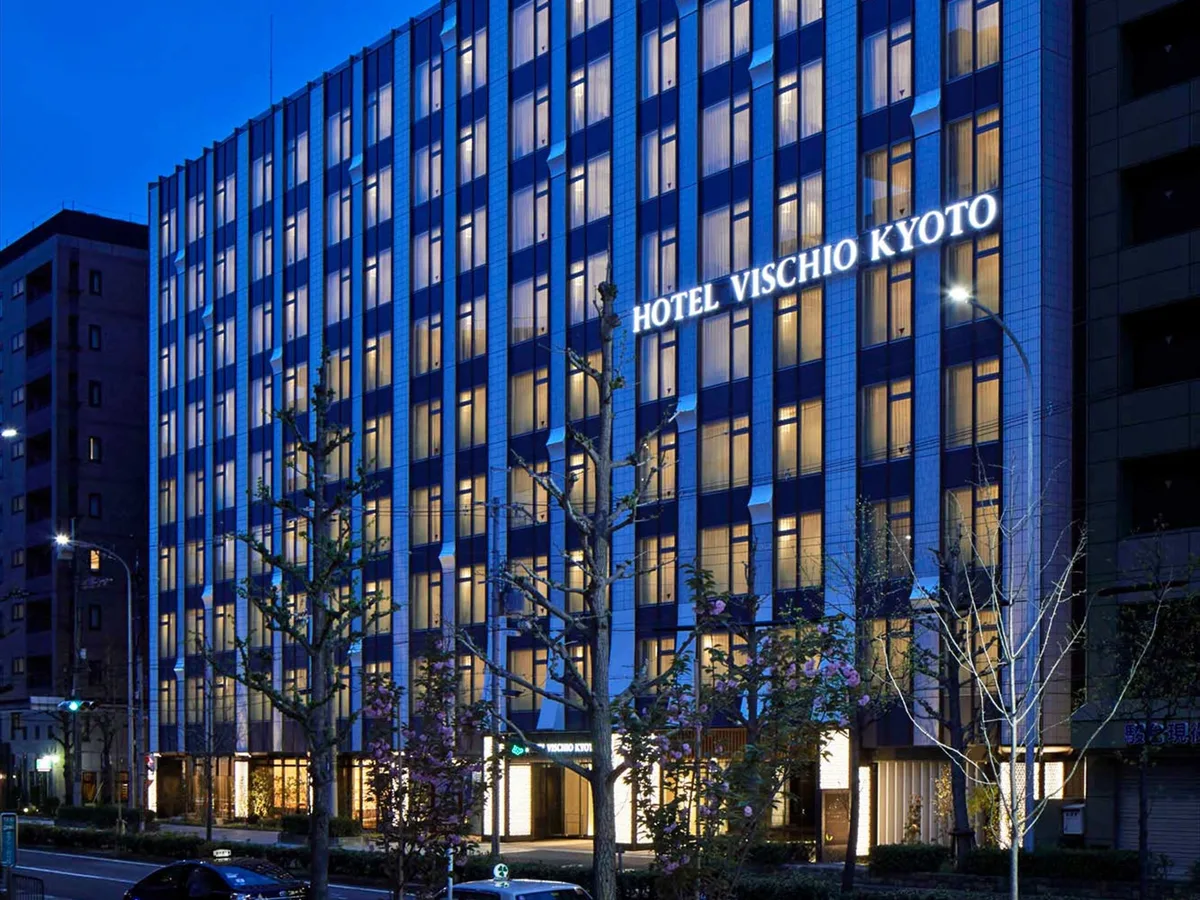 Hotel Vischio Kyoto exterior with illuminated windows and its hotel sign