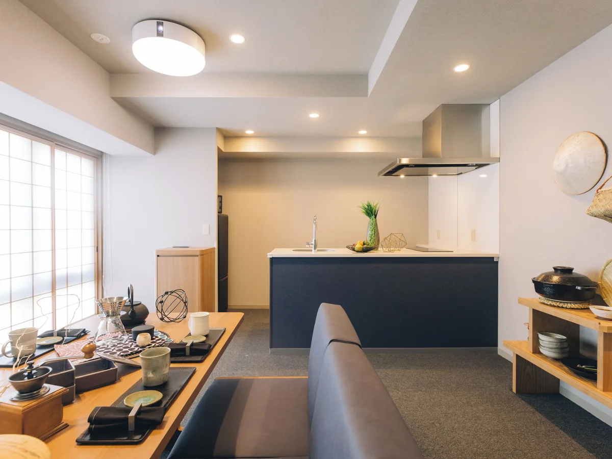 A kitchen, dining table and seating in a suite at MIMARU SUITES Kyoto Shijo