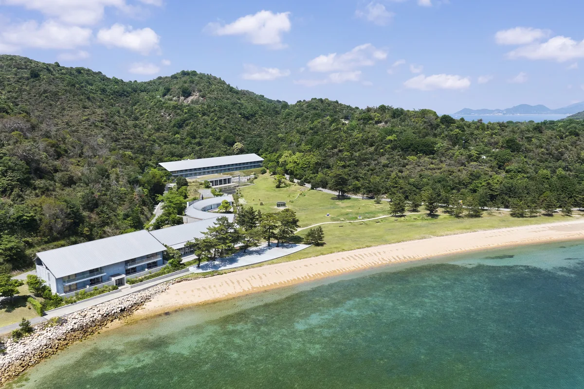 Aerial view of Benesse House buildings, beach and the Seto Inland Sea on Naoshima