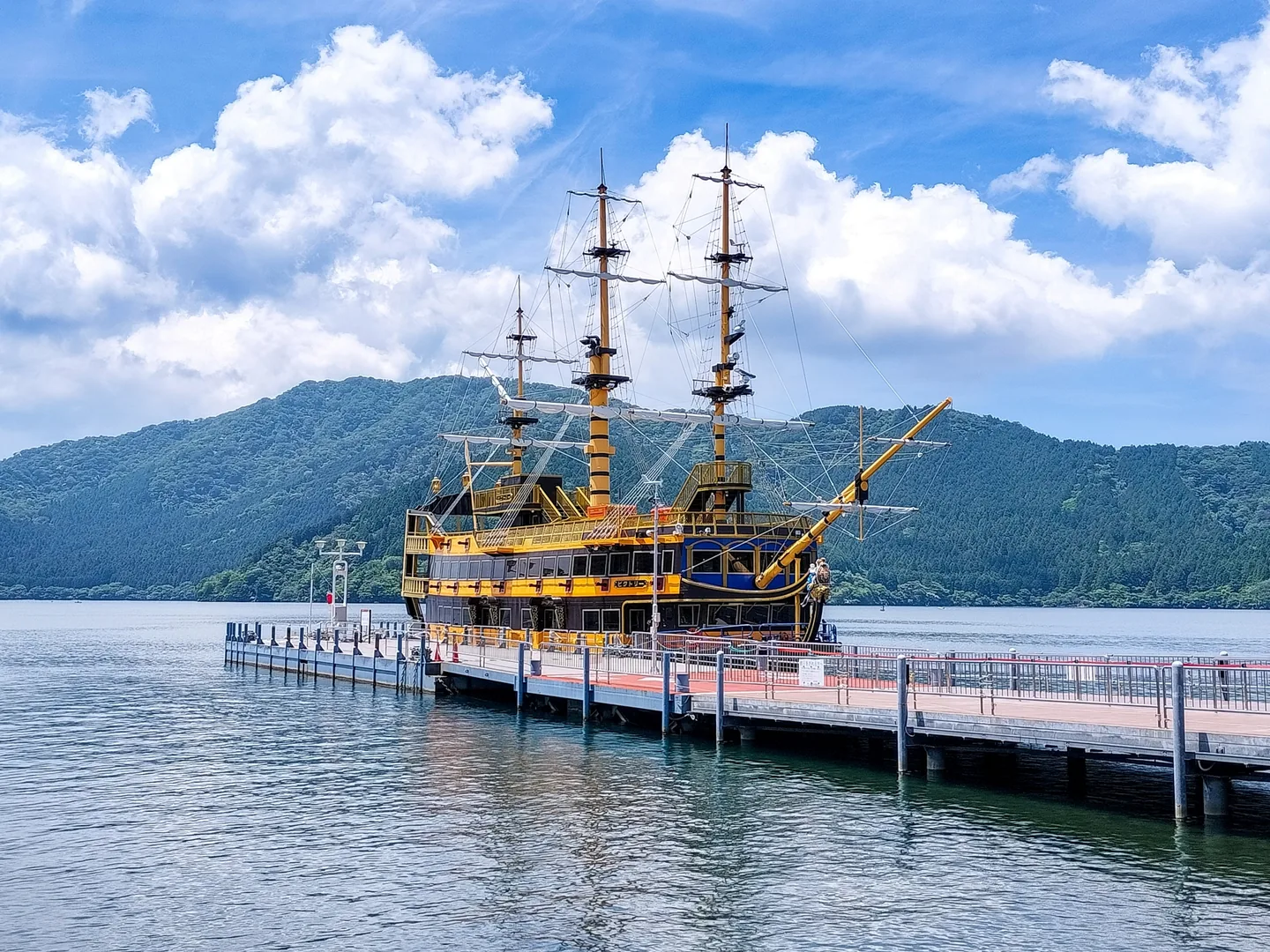 The Victory sightseeing pirate ship docked beside a pier on Lake Ashi