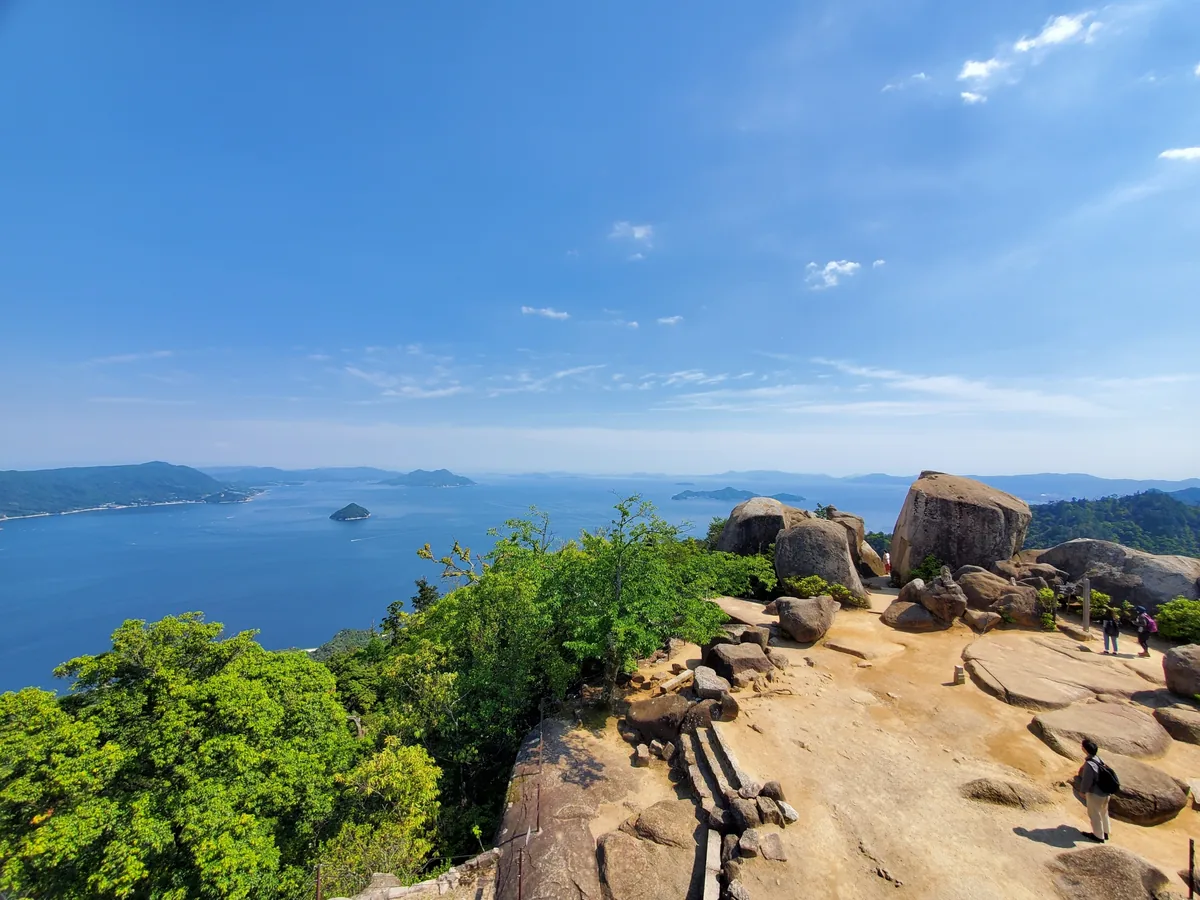 Granite boulders and a viewpoint on Mount Misen overlooking islands in the Seto Inland Sea