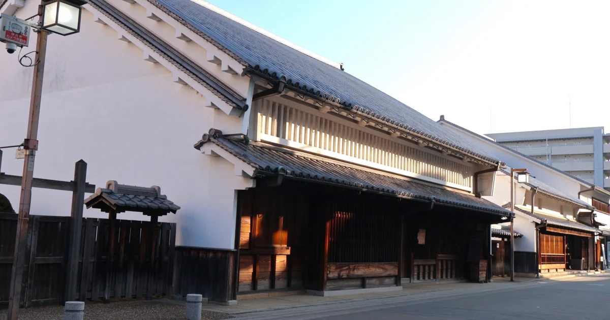 White plaster walls, tiled roofs and wooden frontage of the former Okada residence in Itami