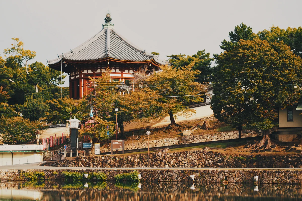 Kofukuji's octagonal Nanendo hall above stone steps and autumn trees