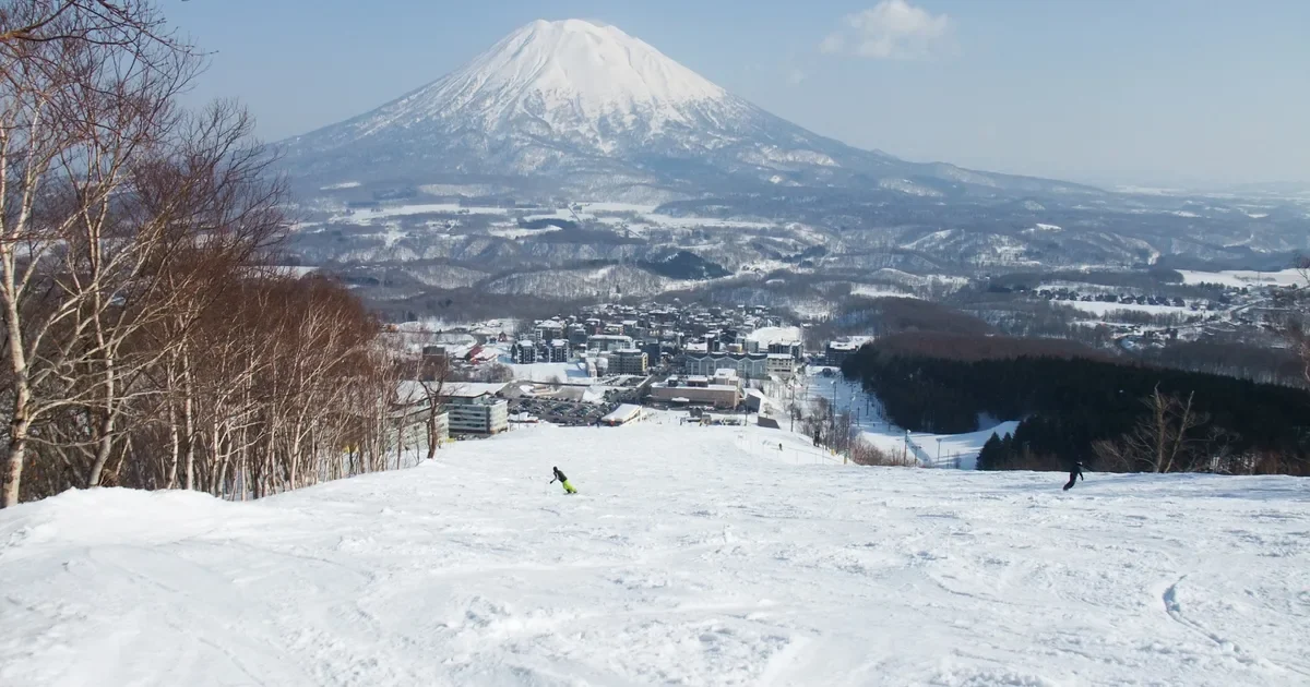 Niseko ski slopes with Mount Yotei beyond the resort buildings