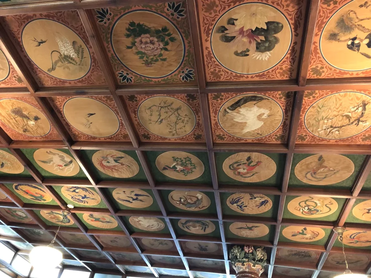Decorated ceiling panels photographed inside Nikko Kanaya Hotel.