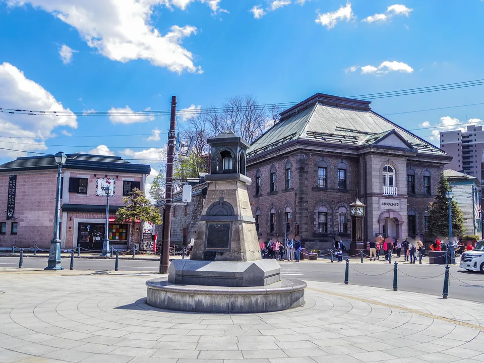 The stone lantern and historic buildings at Marchen Crossing in Otaru