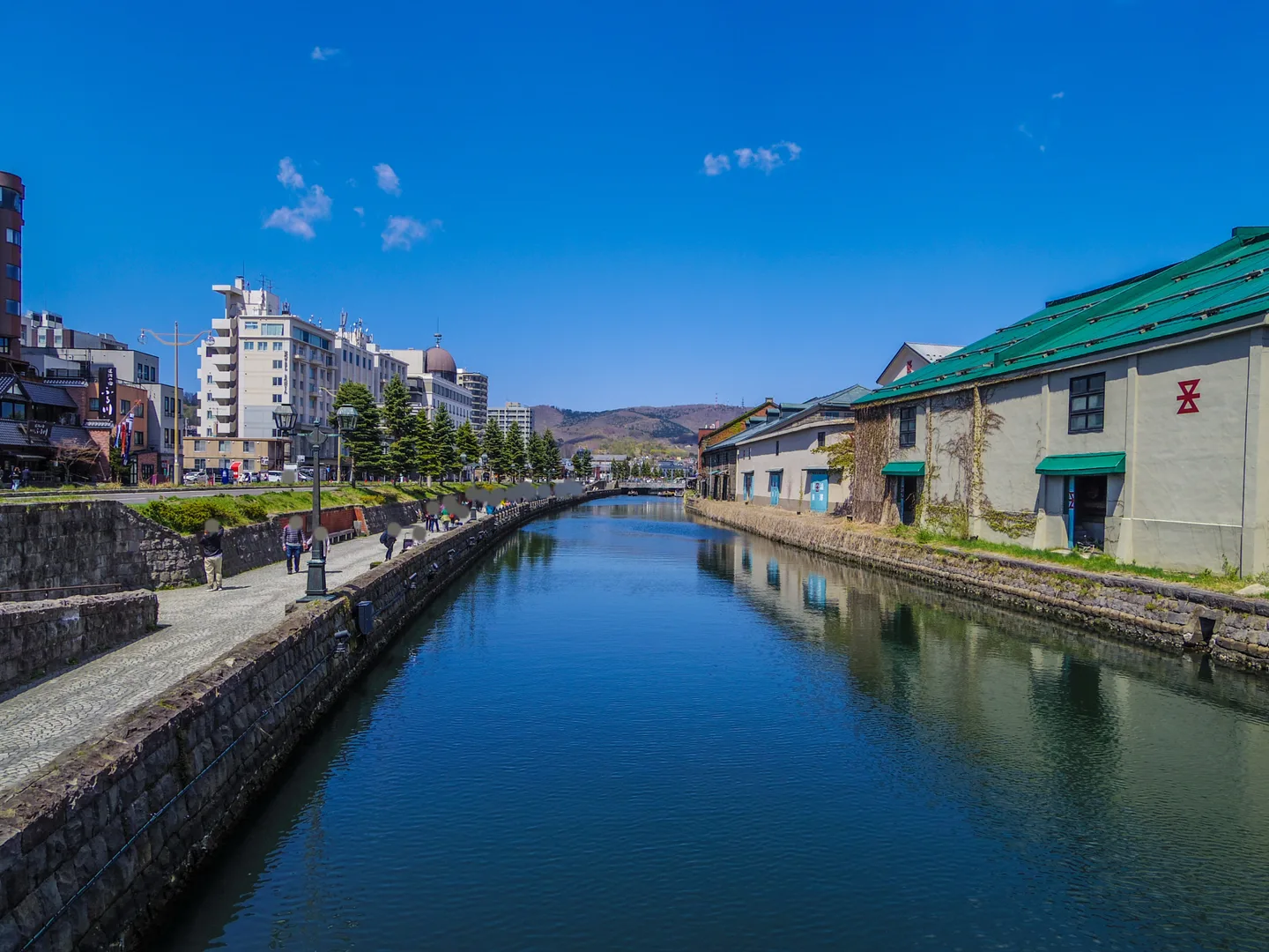 Warehouses and buildings reflected in the still water of Otaru Canal