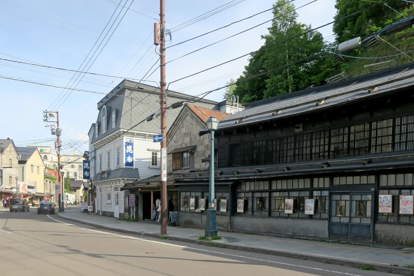 Traditional shops and wooden facades along Sakaimachi Street in Otaru