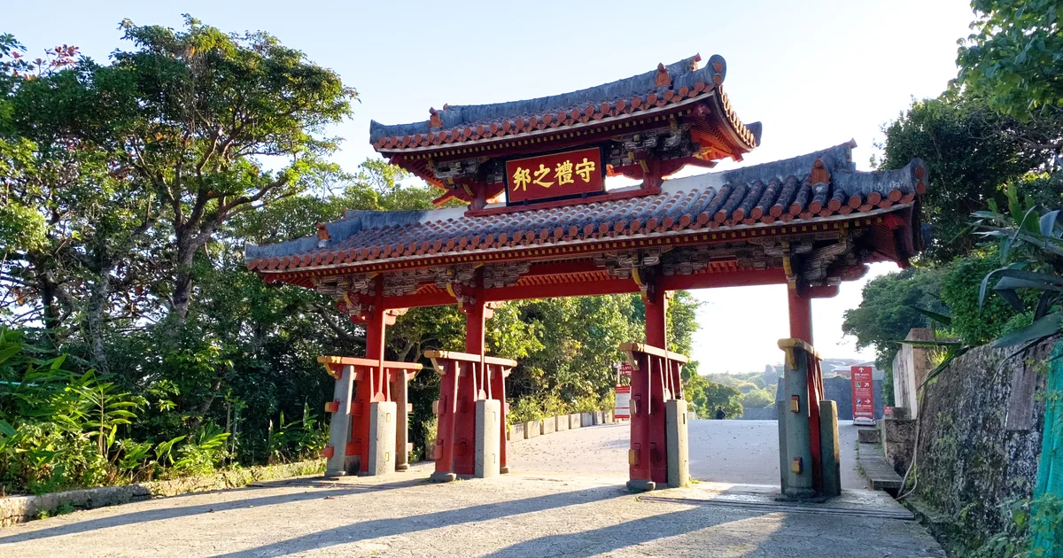 The red tiled roof and pillars of Shureimon gate at Shuri Castle Park