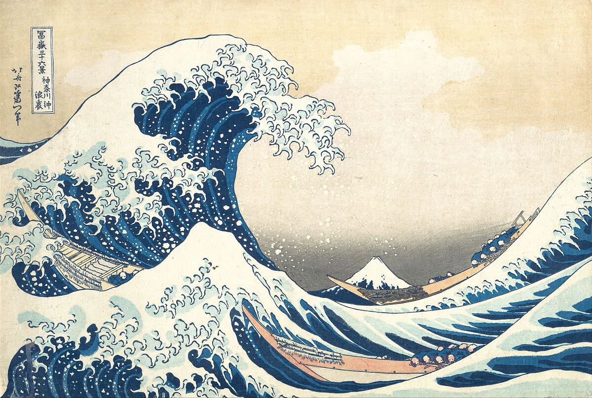 Hokusai’s Great Wave: curling blue waves tower over boats, with a small snow-capped Mount Fuji in the distance.