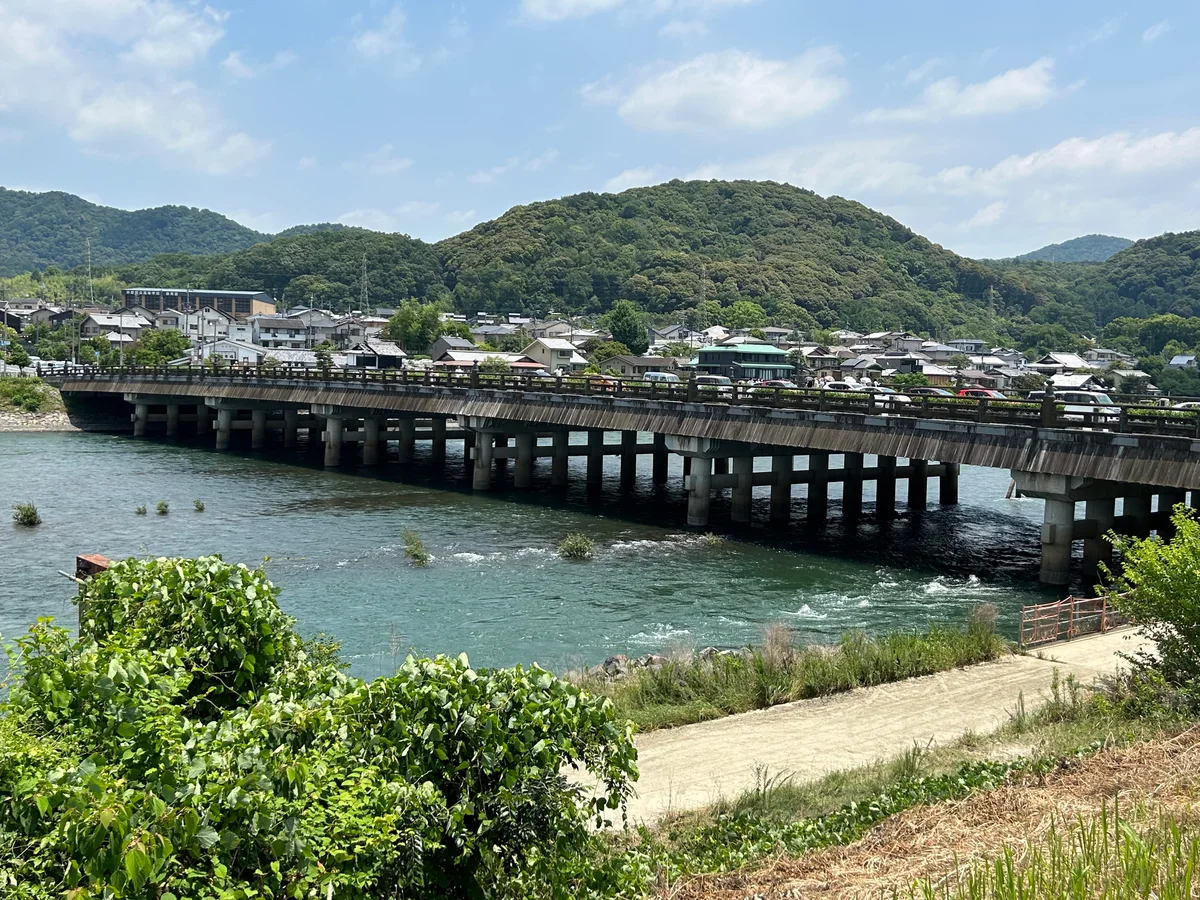 Uji Bridge crossing the river with green hills beyond