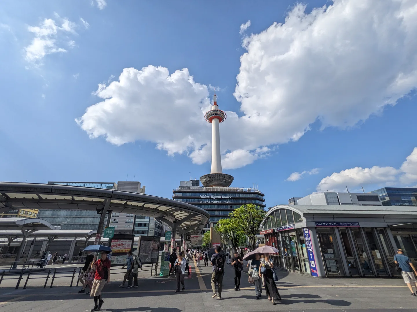Kyoto Tower above the bus terminal and pedestrian forecourt north of Kyoto Station