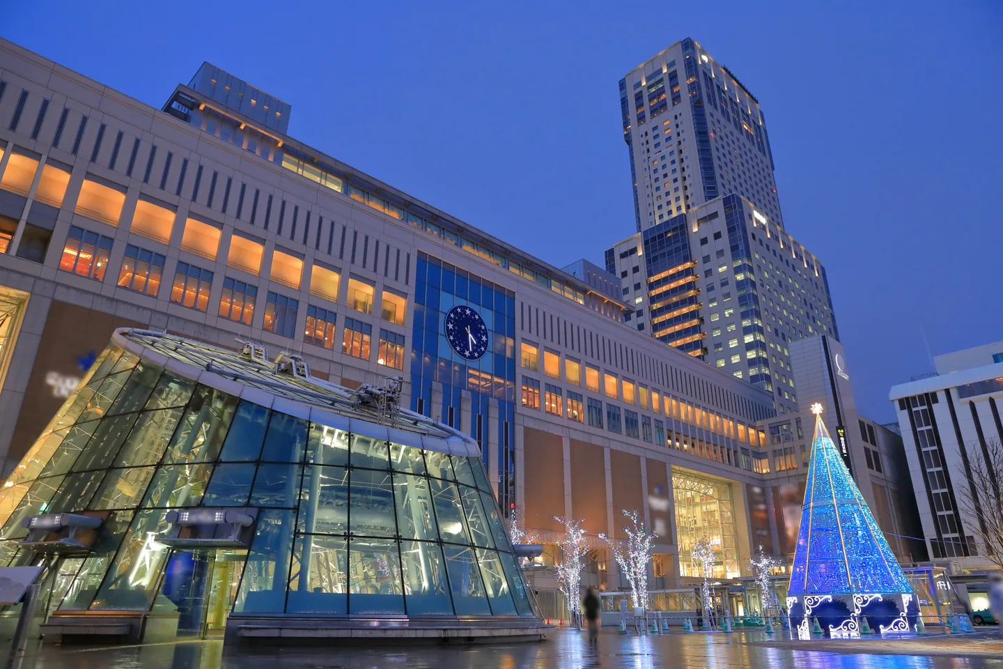 Sapporo Station and JR Tower illuminated at dusk